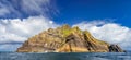 Skellig Lighthouse sticks out from behind off the rock on Skellig Michael island