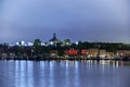 Skeppsholmen an island in Stockholm at night with the Moderna museets lysand roof coupes
