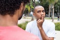 Skeptical african american man in discussion with friend Royalty Free Stock Photo