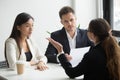 Skeptical diverse hr managers interviewing female applicant, bad Royalty Free Stock Photo