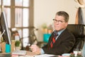 Skeptical Man at His  Desk Royalty Free Stock Photo