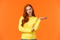 Skeptical and troubled, uncertain young redhead woman cant understand how resolve proble, shrugging raise hands sideways