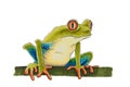 A sketch of a green frog with red eyes sitting on a branch Royalty Free Stock Photo