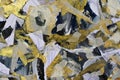 A sketch in the style of abstract impressionism. Pieces of paper ribbon in a chaotic pattern. Painting with golden and black color