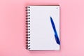 Top view of blank open notebook on pink background, concept of education or new workplace Royalty Free Stock Photo
