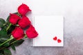 Sketchbook, red rose and decorative hearts on stone background Copy space Top view Valentine`s day card Royalty Free Stock Photo