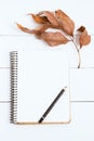 Sketchbooks with pencil on white, wooden background, top view. Toned image, film effect.