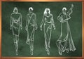Sketches of fashion girls in chalk style on a school blackboard. Stylish fashion models. Young girls. Fashion womans Sketch