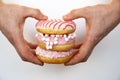 A sketchy plan of a variety of donuts in the hands of a man on a white background. sweet pastries