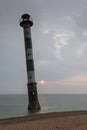 Skew lighthouse in the Baltic Sea. Stormy night on the beach. Harilaid, Saaremaa, Estonia, Europe. Royalty Free Stock Photo