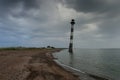 Skew lighthouse in the Baltic Sea. Stormy night on the beach. Kiipsaar, Harilaid, Saaremaa, Estonia, Europe. Royalty Free Stock Photo