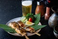 Skewer grilled saba fish with teriyaki sauce.