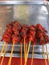 Skewered grilled chicken is sold on the local streets of Thailand