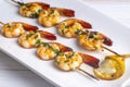 Skewered grilled shrimp with sauce