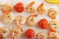 Skewered shrimp with cherry tomatoes on wooden skewers Royalty Free Stock Photo