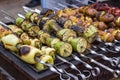 Skewered vegetables green zucchini courgettes cucumber peppers preparing barbecue grill charcoal Grilled roasted fried slices cove