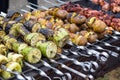 Skewered vegetables green zucchini courgettes cucumber peppers preparing barbecue grill charcoal Grilled roasted fried slices cove Royalty Free Stock Photo