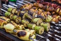 Skewered vegetables green zucchini courgettes cucumber peppers preparing barbecue grill charcoal Grilled roasted fried slices cove Royalty Free Stock Photo