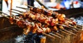 Skewers fried meat on a grill