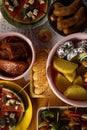 Skewers of grilled meat and vegetables. Lots of food prepared for the grill. A generously set table. Family and friends bbq party Royalty Free Stock Photo