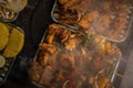 Skewers of grilled meat and vegetables. Veggies and meat on a BBQ grilling on a hot cast iron plate. Family and friends bbq party Royalty Free Stock Photo