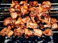 Skewers with meat are fried over the coals Royalty Free Stock Photo