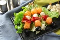 Skewers with melon, prosciutto, mozzarella and olives on plate, closeup Royalty Free Stock Photo