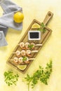 Skewers shrimp barbecue served on wood cutting board with lemon or lime in top view. Delicious grilled prawn with spices for Royalty Free Stock Photo