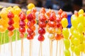 Skewers of sugar-coated fruit Royalty Free Stock Photo