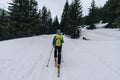 Ski alpinist training in the snowy Austrian Alps with equipment during the daytime