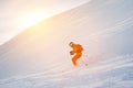 Ski athlete in a fresh snow powder rushes down the snow slope Royalty Free Stock Photo