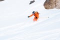 Ski athlete in a fresh snow powder rushes down the snow slope Royalty Free Stock Photo