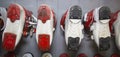 Ski boots of various colors installed in a row with the soles up in the rental of ski equipment. Sports Royalty Free Stock Photo