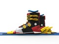 Ski boots with yellow straps and blue skiis Royalty Free Stock Photo