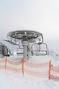 Ski chair lift Back view. Barriers in the foreground. Snow-covered winter landscape Royalty Free Stock Photo