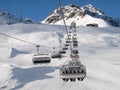 Ski chair-lift with skiers Royalty Free Stock Photo