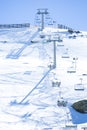 Ski chair lift with skiers. Ski resort in Sierra Nevada