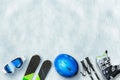 Ski equipment placed on snow. Free space above for text, logo promotion. Winter ski vacation concept