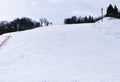 Ski field large white snow on slopes. Tourists come to play winter sports. Ski slopes snow. Royalty Free Stock Photo