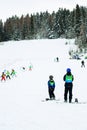 Ski instructor and kids at ski school Royalty Free Stock Photo