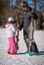 Ski instructor and little girl