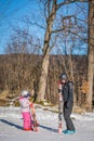 Ski instructor and little girl