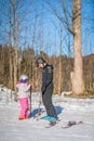 Ski instructor and little girl