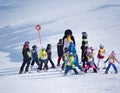 Ski instructor in a penguin suit studies children in ski school. Ski resort in Alps, Austria, Zams on 22 Feb 2015