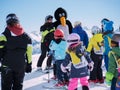 Ski instructor in penguin suit studies young skiers. Ski resort in Alps, Austria, Zams on 22 Feb 2015. Skiing, winter season, moun