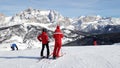 Ski instructor and skier in Dolomites