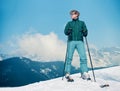 Ski instructor young man on the top of snow hill Royalty Free Stock Photo