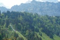 Ski jumping bridge on the slope of Alp mountains in Engelberg region, canton Obwalden in Switzerland in the springtime.