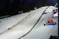 Ski jumping competition on a ski jumping hill in Wisla in southern Poland at night