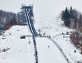 Ski Jumping - Rasnov, Romania: Unknown ski jumper competes in the FIS Ski Jumping World Cup Ladies Royalty Free Stock Photo